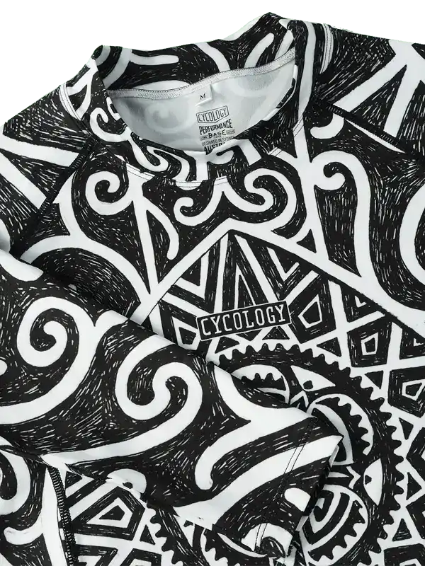 Black and white patterned cycling jersey with bold geometric and swirl designs, featuring 'CYCOLOGY' logo.