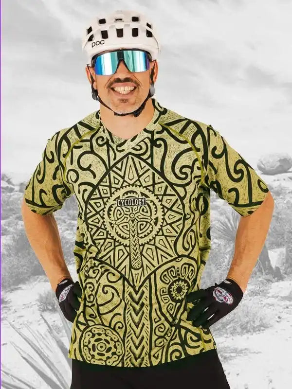 Man wearing patterned cycling jersey, helmet, and sunglasses for mountain biking