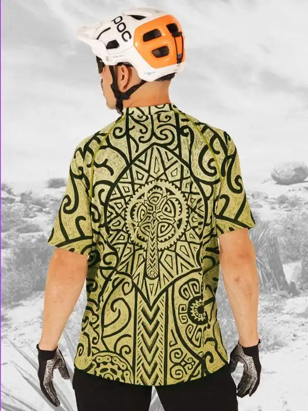 Men's cycling jersey with bold tribal print, worn with POC helmet and gloves for mountain biking