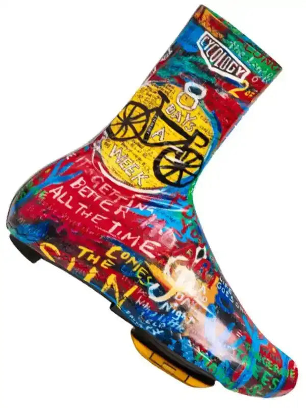 Colorful cycling shoe cover with bold graphics and motivational text for road bike riders