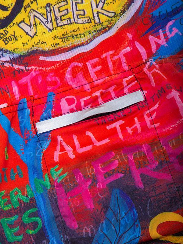 Vibrant graffiti-style cycling jersey with bold text and colorful artwork, perfect for urban rides.