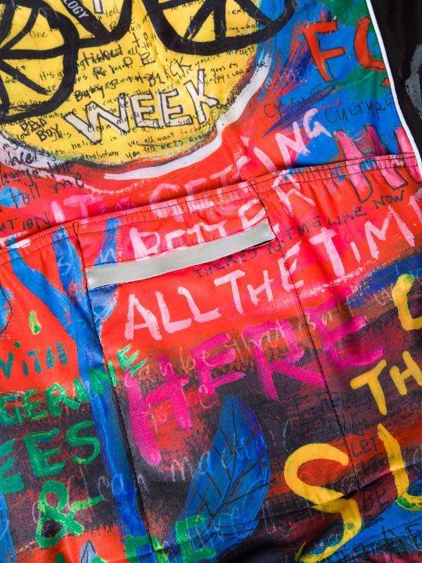 Colorful cycling shorts with graffiti-style art and bold text design for men and women