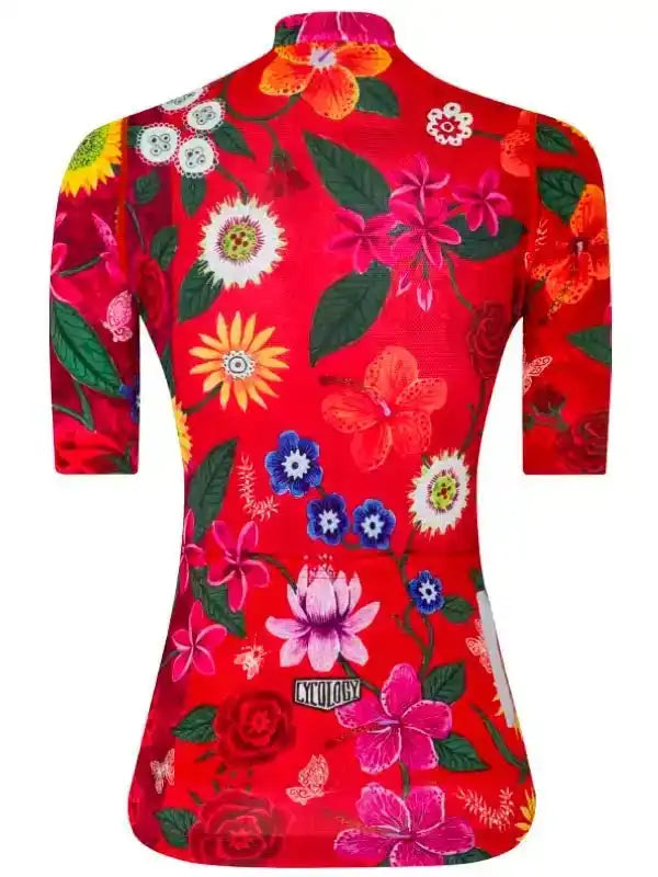 Red women's cycling jersey with vibrant floral print, short sleeves, and brand logo on back