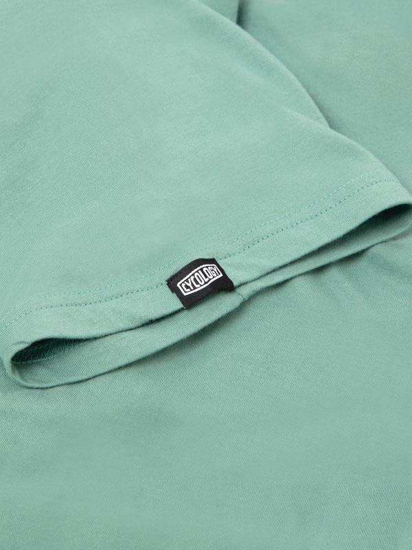 Mint green cycling t-shirt with black CYCOLOGY tag, soft fabric detail for men's and women's bike wear