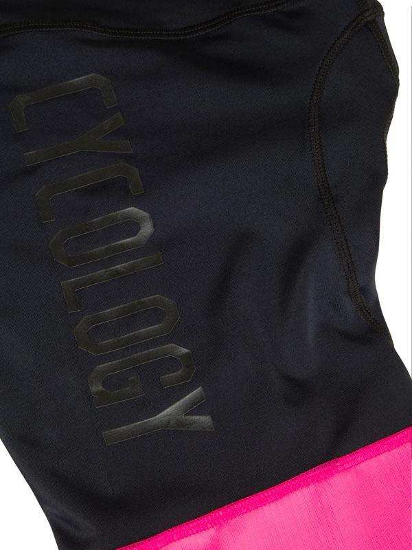 Black cycling jersey with 'CYCOLOGY' logo and pink hem, women's performance wear