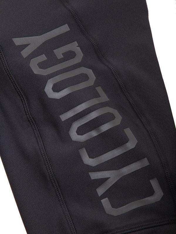 Black cycling shorts with bold 'CYCOLOGY' logo, performance fabric, seamless stitching for comfort
