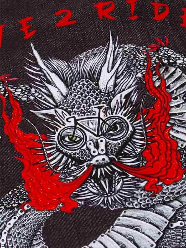 Dragon cycling graphic with red flames on black fabric, unique bike apparel design