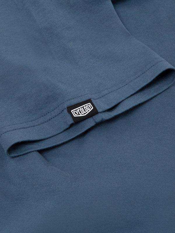 Cycology branded tag on blue cycling apparel, showcasing quality fabric and design detail