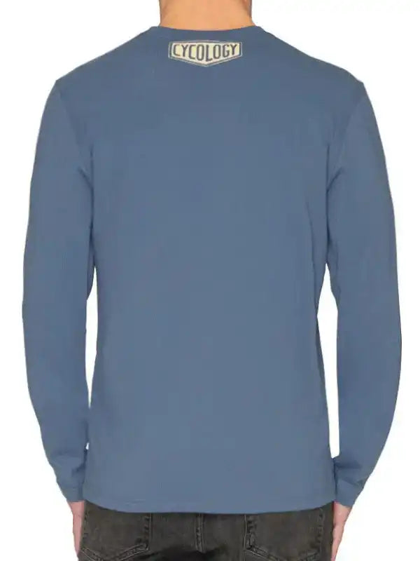 Men's blue long sleeve cycling shirt with Cycology logo on back, casual fit for everyday wear