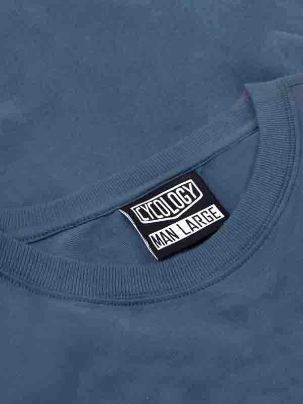 Cycology men's large size tag on blue cycling apparel, high-quality fabric detail