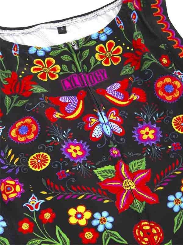 Vibrant floral and bird print women's cycling jersey with colorful design on black fabric