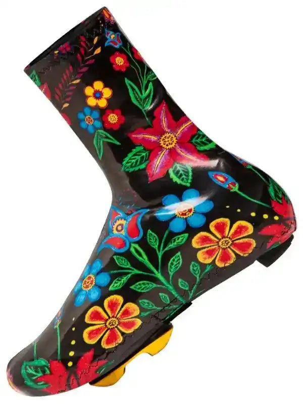 Black cycling shoe cover with vibrant floral print for wet weather rides