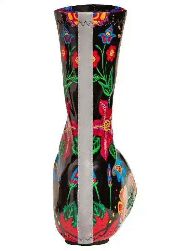 Black rain boot with vibrant floral print and reflective stripe, ideal for cycling or wet weather