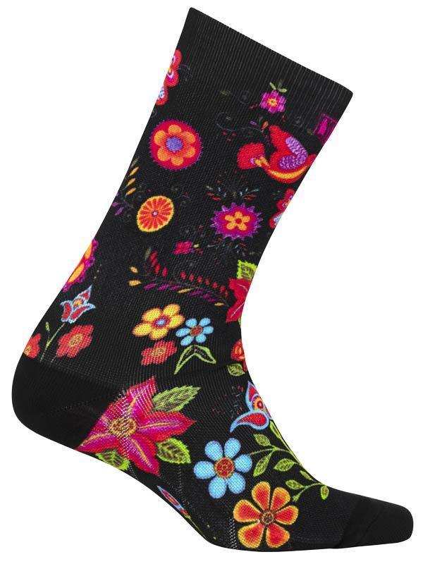 Black cycling sock with vibrant floral pattern, colorful flowers and leaves on dark background