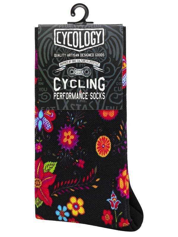 Cycling performance socks with vibrant floral pattern on black, designed for bike culture and lifestyle.