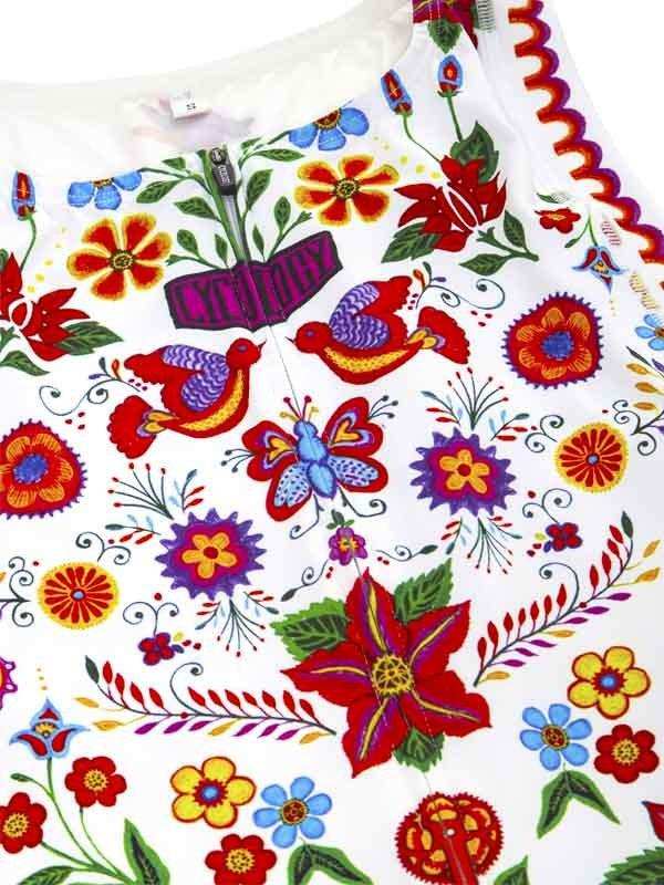 Vibrant floral and bird print cycling jersey with colorful folk art design on white fabric