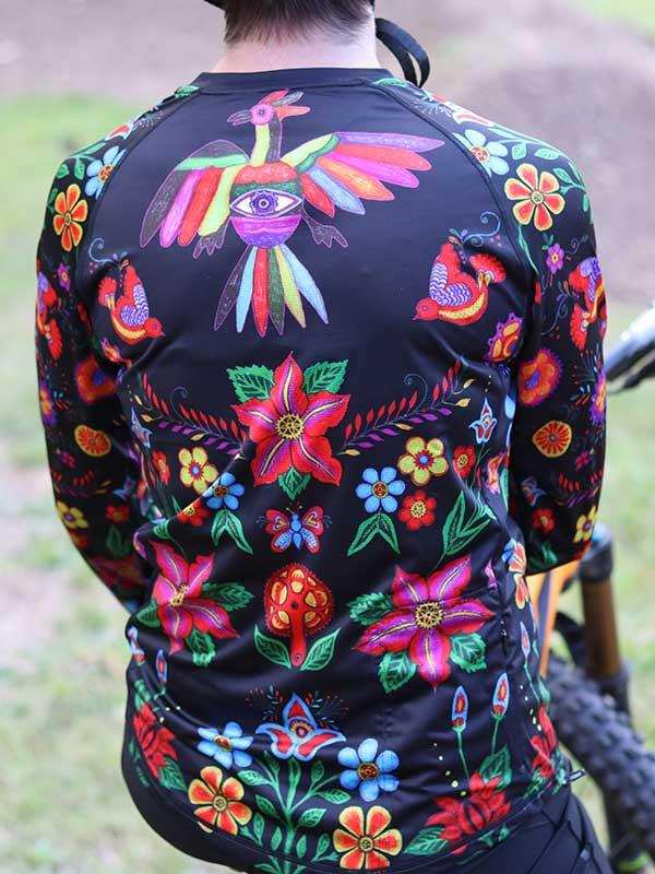 Men's cycling jersey with vibrant floral and bird print, ideal for mountain biking adventures.