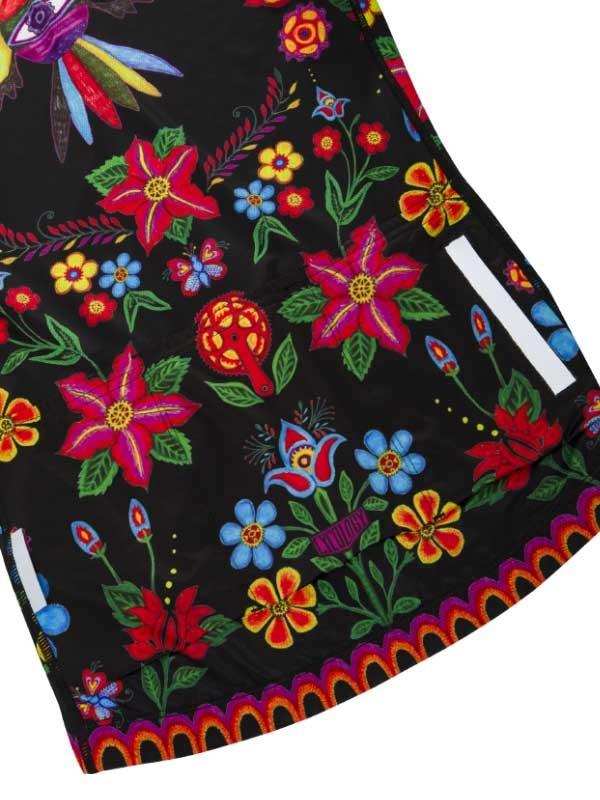 Vibrant floral cycling jersey with colorful flowers and butterflies on black fabric, ideal for women's cycling wear