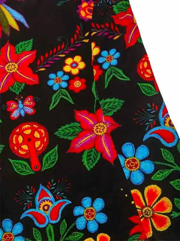 Vibrant floral cycling jersey with bold red, blue, and yellow flowers on black fabric