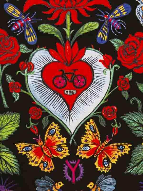 Vibrant cycling-themed floral pattern with heart, butterflies, and bike motif on dark background