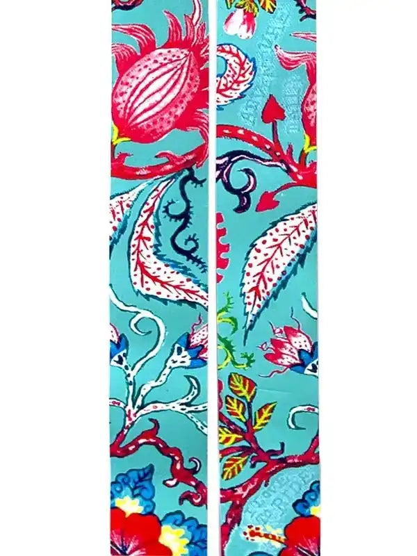 Vibrant floral cycling jersey fabric with turquoise background, red blooms, and leaf patterns for women's bike wear