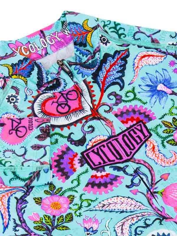 Vibrant floral cycling jersey with bold patterns and 'Cycology' branding, ideal for women's bike wear.