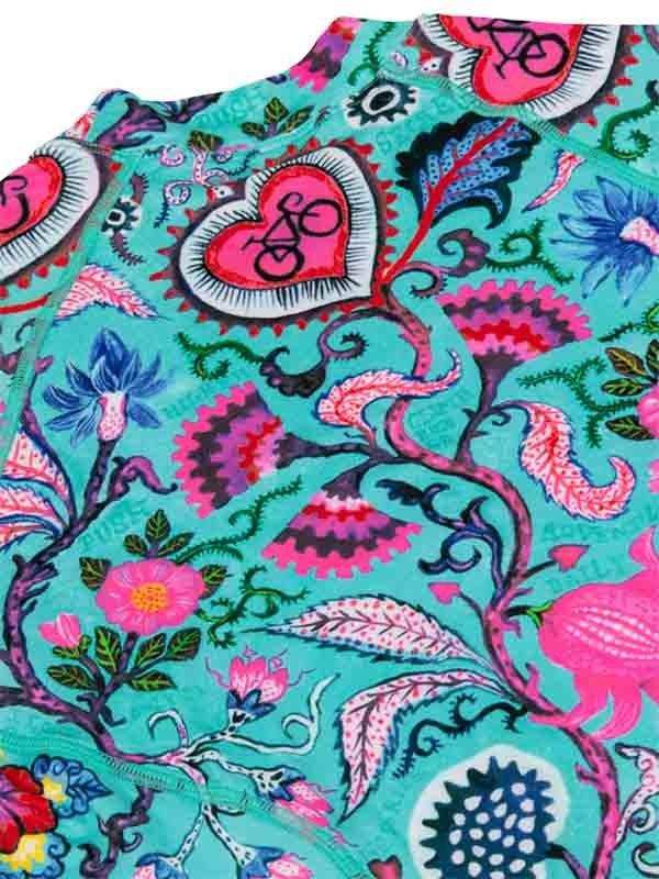 Vibrant turquoise cycling jersey with pink hearts, floral patterns, and bike motifs for women's road cycling apparel.