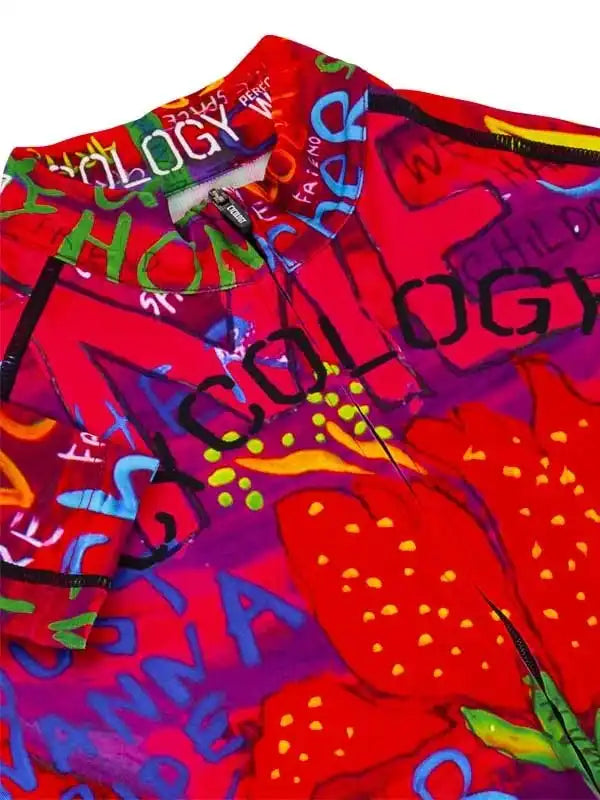 Vibrant red cycling jersey with bold graffiti-style graphics and colorful text design