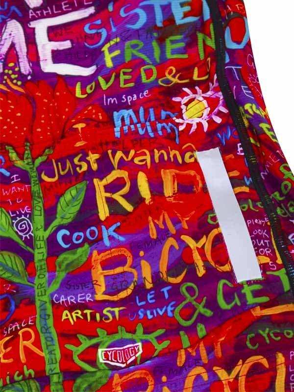 Colorful cycling shorts with bold text art, featuring 'RIDE MY BICYCLE' and vibrant graphics for women's bike wear.
