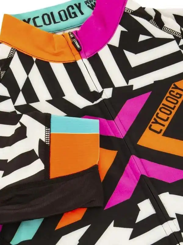 Vibrant geometric cycling jersey with bold black, white, pink, orange, and teal accents for men and women