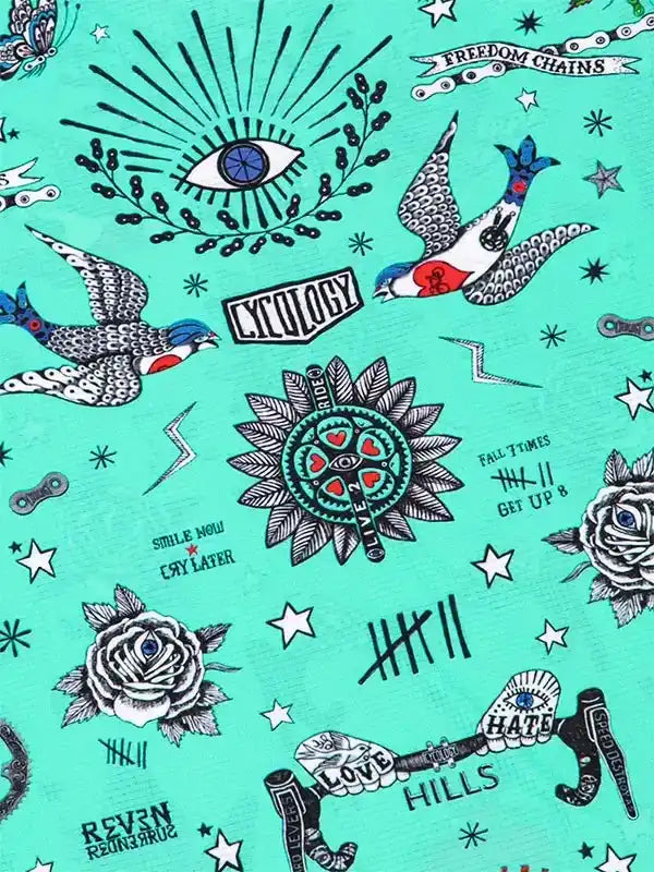Cycling-themed fabric print with tattoos, birds, roses, and motivational phrases on teal background