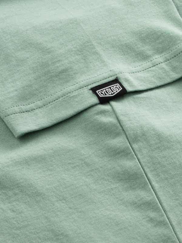 Mint green cycling jersey with Cycology brand tag, soft fabric detail