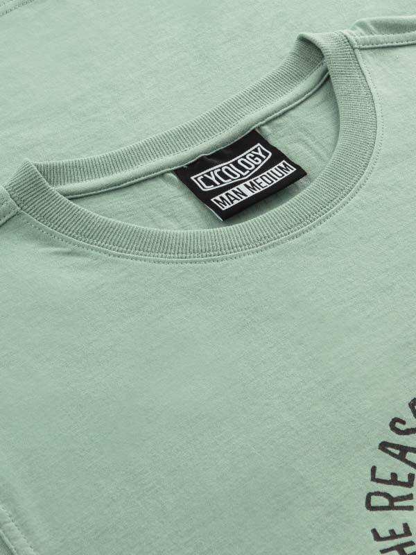 Mint green men's cycling t-shirt with Cycology brand tag and partial graphic print, soft fabric detail