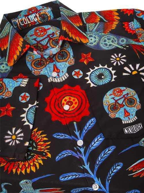Men's cycling shirt with vibrant skull, bike, and floral print on black fabric