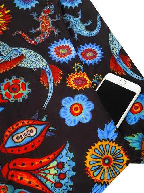 Vibrant cycling shorts with colorful lizard and floral print, featuring phone pocket for convenience