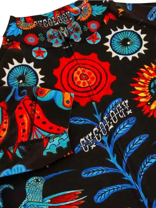 Vibrant cycling shorts with bold skull, sunflower, and hummingbird print on black fabric