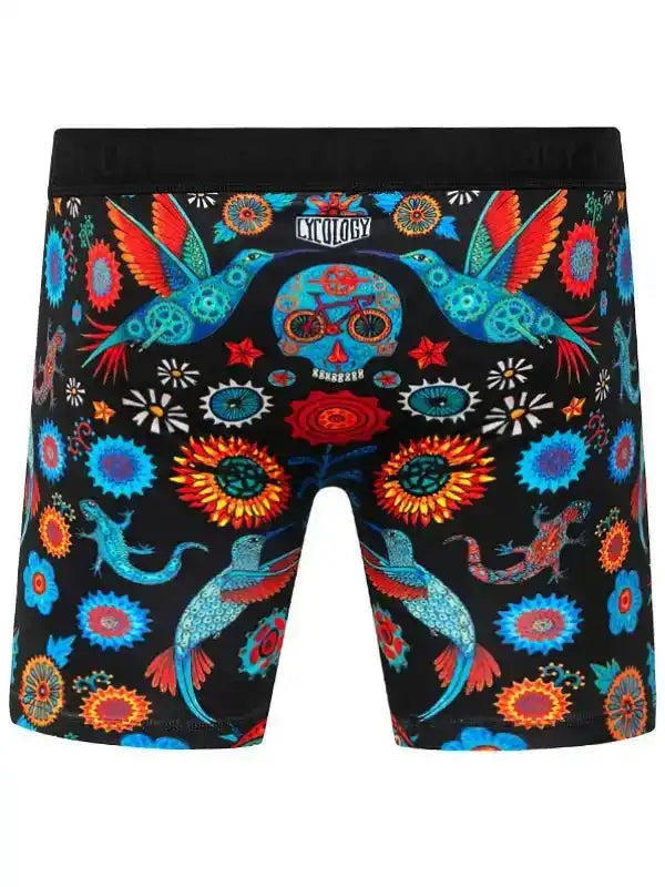 Men's cycling boxer briefs with vibrant hummingbird and floral print on black background