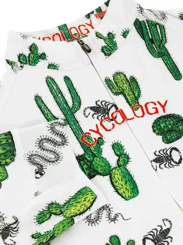 White cycling jersey with green cactus and scorpion print, red 'CYCOLOGY' text, zipper front