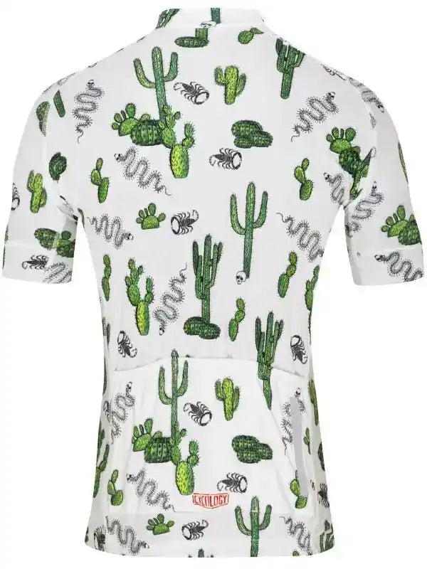 White cycling jersey with cactus, snake, and scorpion print, featuring rear pockets and brand logo.