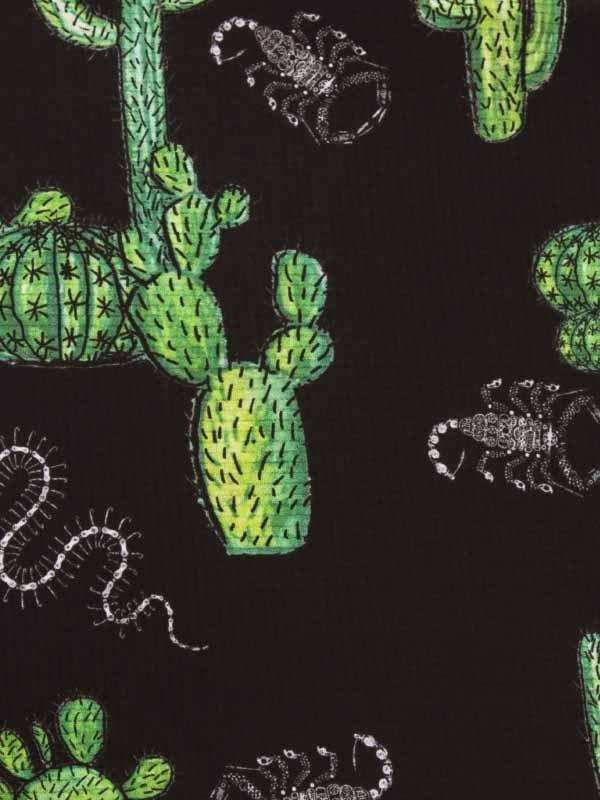 Black cycling fabric with green cactus and white scorpion print design