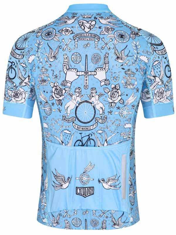 Light blue men's cycling jersey with tattoo-style graphics, roses, birds, and bike motifs, featuring rear pockets and reflective details.