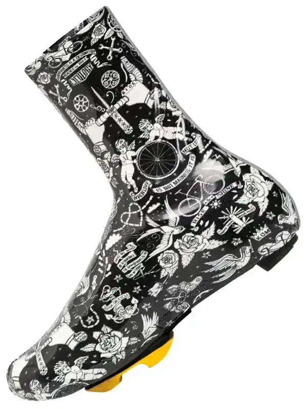 Black cycling shoe cover with white tattoo-style graphics, featuring roses, bikes, and wings for road cycling protection.