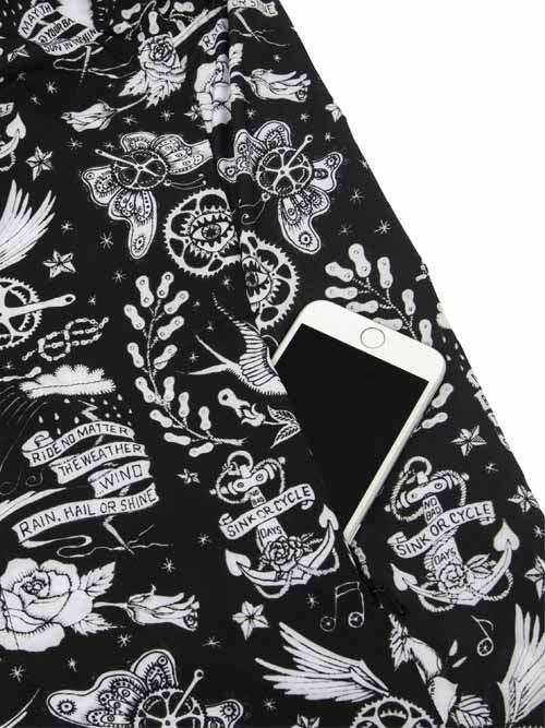 Black cycling jersey with white tattoo-style graphics, anchors, butterflies, and 'Ride No Matter' text