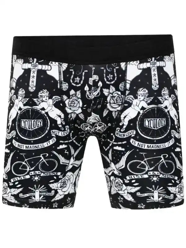 Men's cycling shorts with black and white tattoo-style print featuring bikes, roses, and cherubs