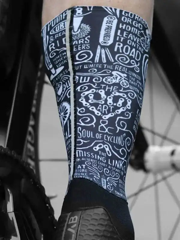 Cycling leg warmers with bold typography and bike graphics, perfect for road riders