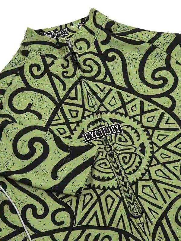 Green cycling jersey with black tribal and gear pattern, featuring Cycology logo on chest