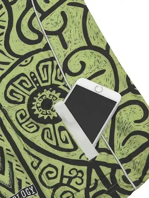 Green cycling shorts with bold black abstract print and phone pocket, ideal for men's and women's rides